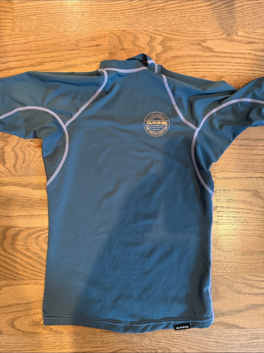 Dakine Teal Short-Sleeve Women's Rash Guard with Light Blue Stitching
